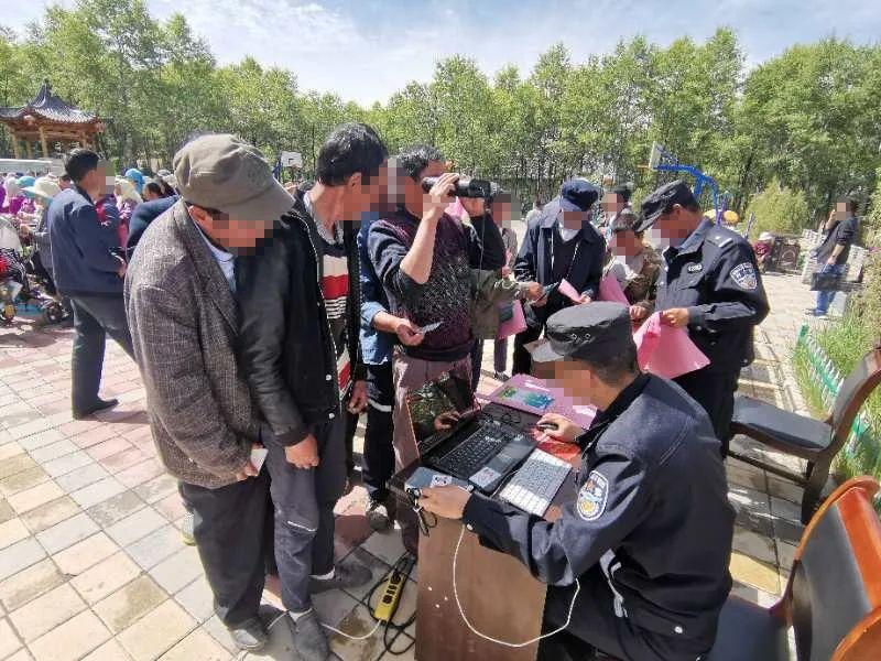 Police gather iris scans in a public area. 