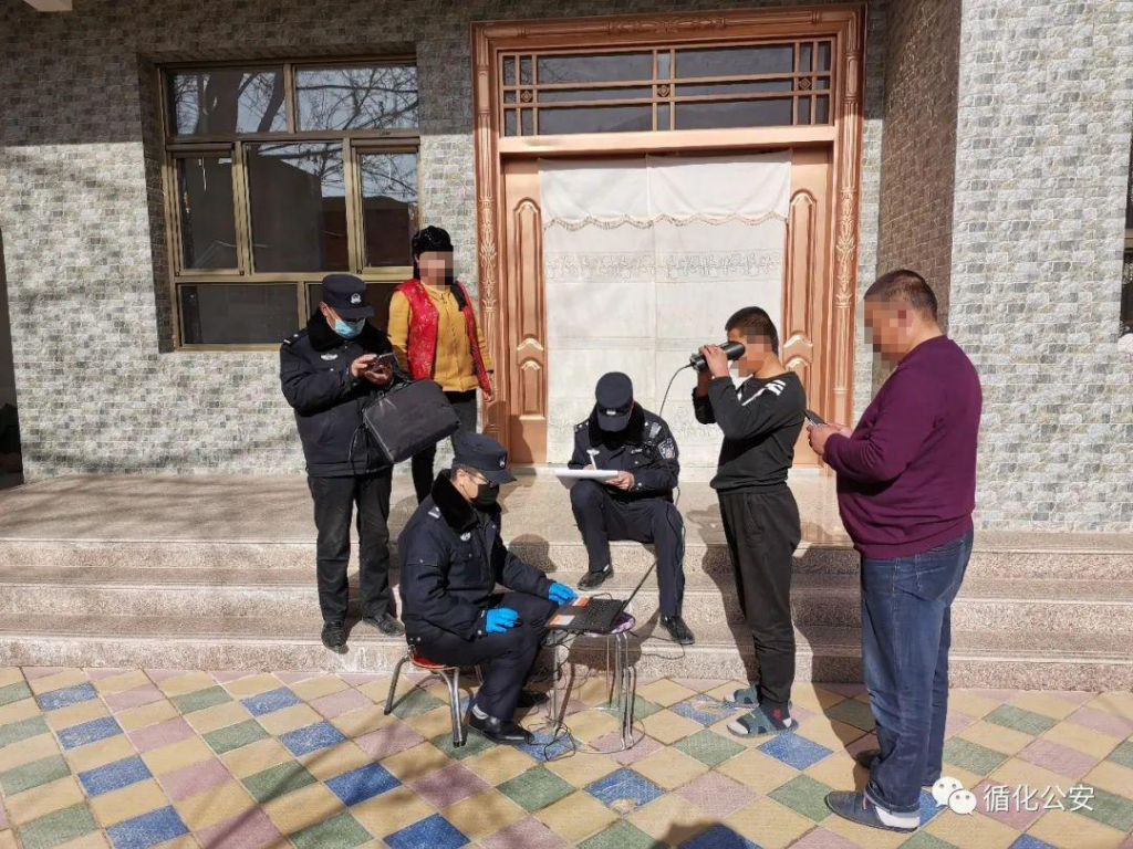 Police collect iris scans at a family home.